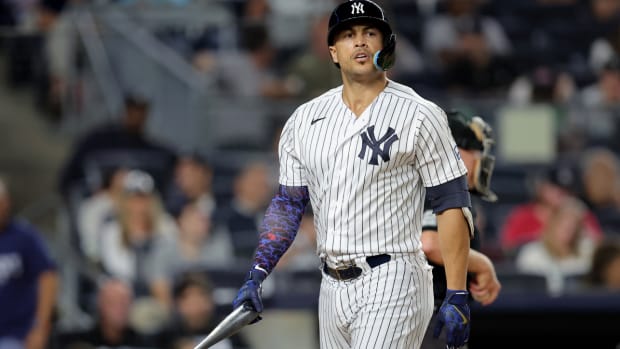 Aug 22, 2023; Bronx, New York, USA; New York Yankees designated hitter Giancarlo Stanton (27) reacts after striking out to end the eighth inning against the Washington Nationals at Yankee Stadium. Mandatory Credit: Brad Penner-USA TODAY Sports  